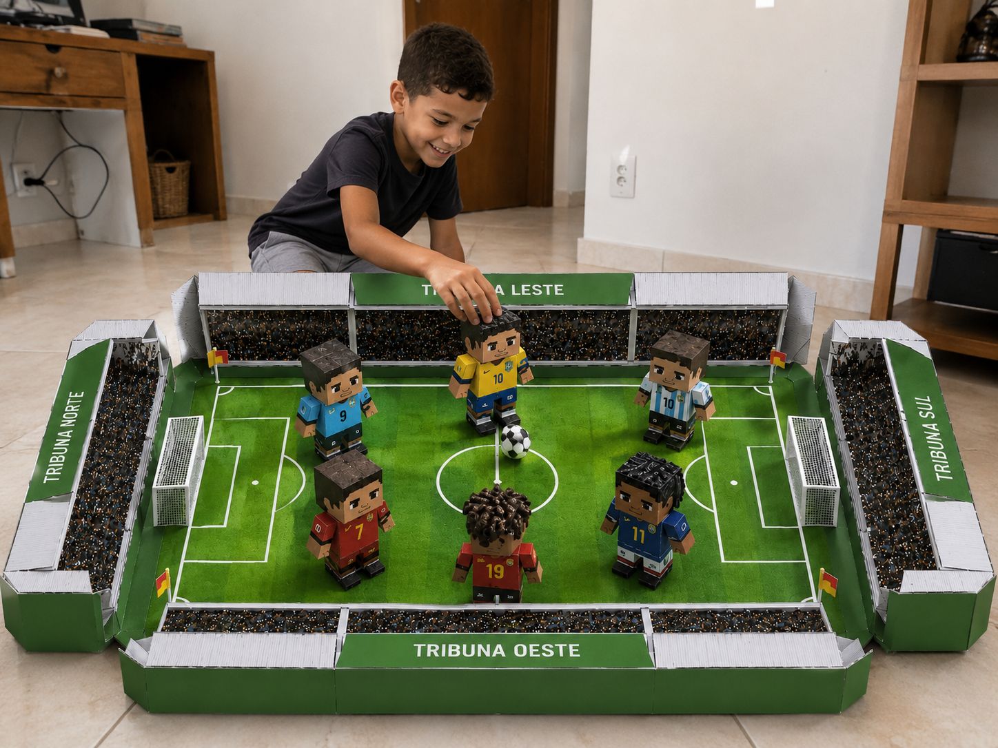 Mini estádio de papercraft montado com os craques